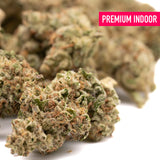 Premium indoor thca flower nascar indoor strawnana x papaya buds with dense green brown hues and maximum potency trichomes