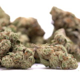 Greenhouse smalls cannabis buds with frosty texture in nectarine jelly thca mix featuring unprecedented sweet-savory aroma