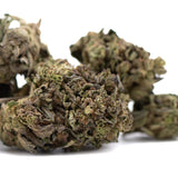 Mature orange runtz thca flower with dense frosty trichomes and green brown purple hues for morning motivation