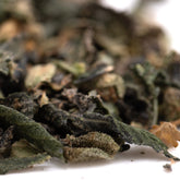 Dried green tea leaves with dark and light shades in party animals indoor thca trim wholesale packaging