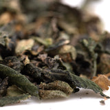 Dried green tea leaves with dark and light shades in party animals indoor thca trim wholesale packaging