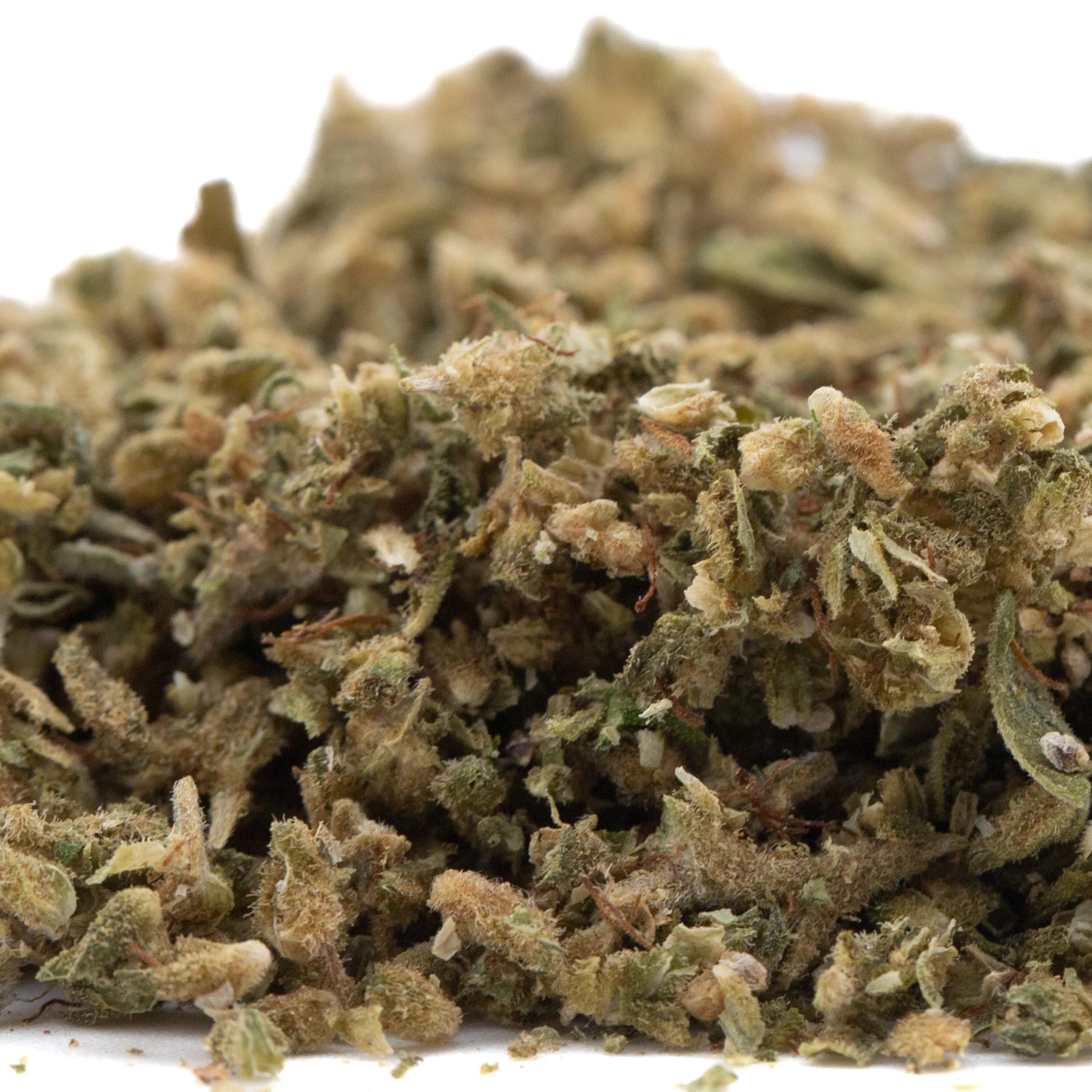 A dense green and brown cannabis bud with trichomes from pivot full-term pre-converted cbd hemp flower trim with high cbd content