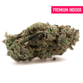 A dense greenish-gray platinum huckleberry cookies hemp flower bud with frosty trichomes and brown pistils, girl scout strain