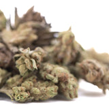 A pile of poison gushers thca hemp flower greenhouse smalls with green brown and orange trichomes