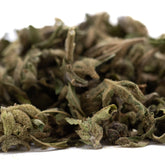 Dried green pound town full-term thca trim wholesale hemp flower with fuzzy texture and visible stems showing cannabinoid content
