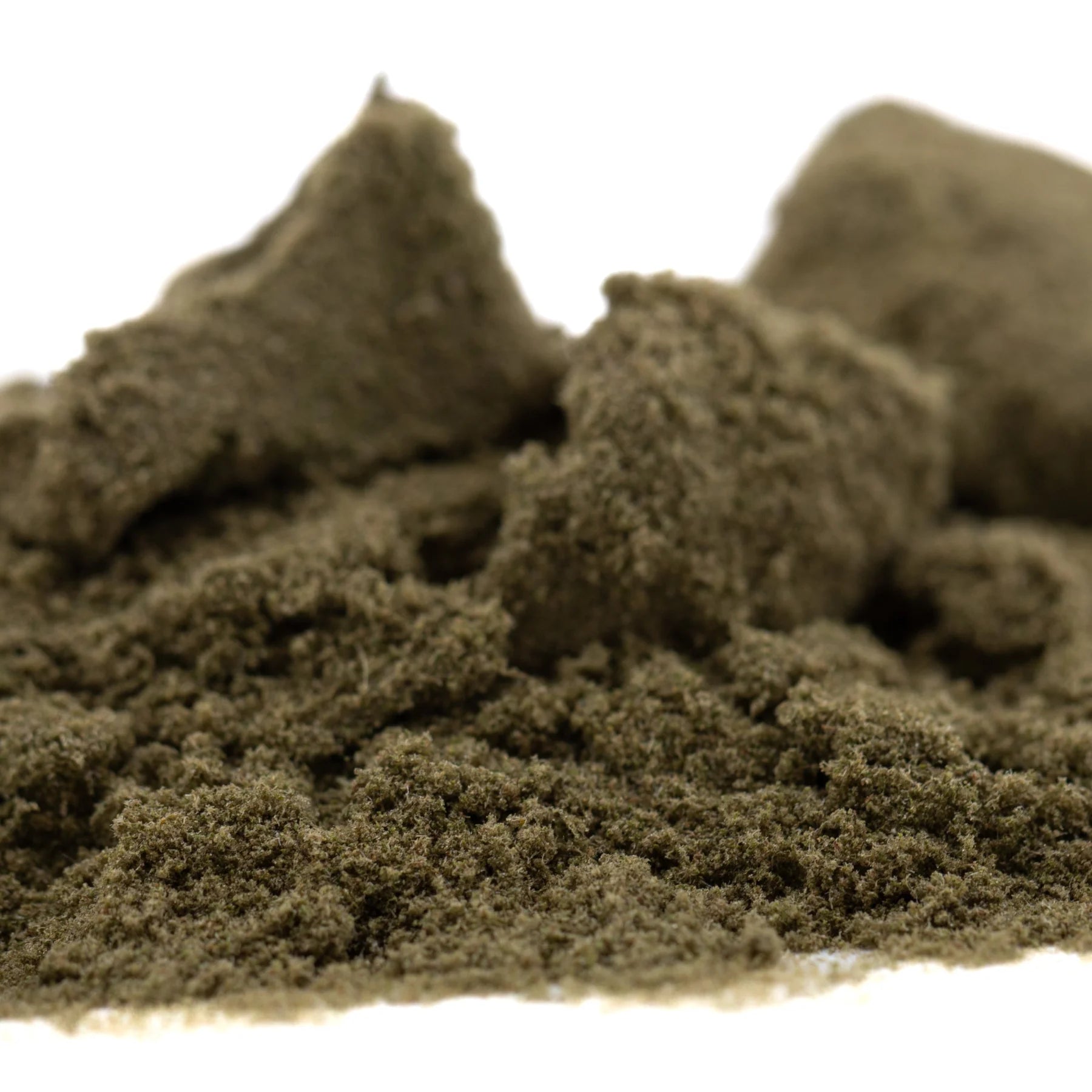A mound of olive-green kinetic sand with a fine clumpy texture in pound town thca kief full-term product packaging