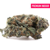 Purple daiquiri indoor thca hemp flower showing dense green and brown bud with frosty white trichomes like grape pie