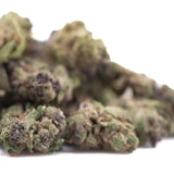 Green and purple cannabis buds with a dense, textured surface.