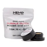 A sleek black glass jar with lid containing light purple punch thca budder wax from hemp flower co labeled purple punch