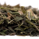 Dried mint leaves with green and brown hues showing texture in purple wedding greenhouse thca trim wholesale