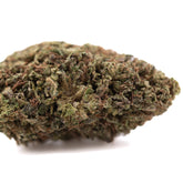 Dense green royal og cbd hemp flower with trichomes and brown pistils showcasing cannabinoid potency like bubba kush