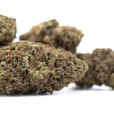 Green and brown royal og cbd full-term hemp flower buds with dense textured surface and high cannabinoid potency for cbd wholesale full-term use