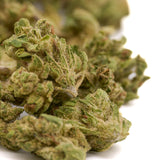 Light green dried cannabis buds with trichomes from Sauerkraut THCa Hemp Flower Smalls featuring Sour Diesel strain