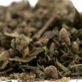 Dried sour apple full-term thca trim with green and brown hues covered in fine trichomes from legendary genetics