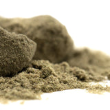 A mound of light brown thca kief with a textured surface for sour apple sour diesel legendary genetics