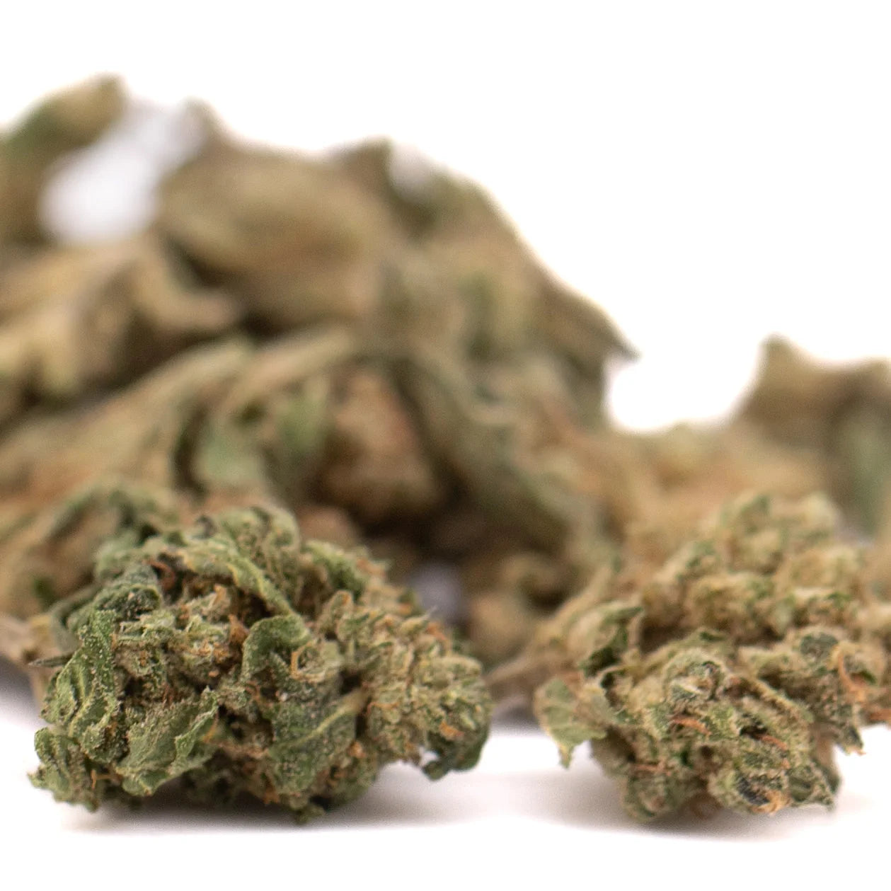 Dried sour chem cbd hemp smalls flower with dense greenish brown buds and visible trichomes for cbd use