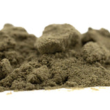 A mound of olive-green sour diesel thca kief with granular texture showcasing industry-leading cbga mexican sativa fuel