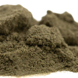 A mound of fine olive-green sour diesel thca kief showcasing industry-leading cbga from the legendary fuel mexican sativa