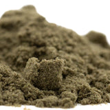A mound of textured olive green kinetic sand representing sour diesel thca kief full-term wholesale mexican sativa