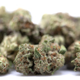 Subzero thca hemp flower greenhouse smalls with green and orange hues and frosty total cannabinoids for body-melting effects