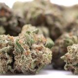 Subzero thca hemp flower greenhouse smalls with green and orange hues and frosty texture for body-melting effects and total cannabinoids