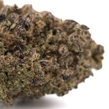 Dense textured sugar thca hemp flower with green and purplish hues covered in trichomes legendary cinderella strain