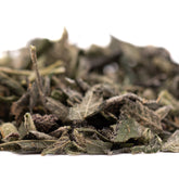 Dried green tea leaves from Super Runtz Indoor Trim Wholesale 1LB with lemon cherry gelato flavor and THCA trim