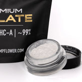 A clear glass jar with a black lid containing white thca isolate powder by oregon hemp flower for therapeutic benefits