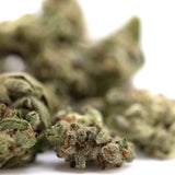 Top Gun THCa Flower Smalls: Marijuana bud with green leaves and orange trichomes