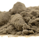 A mound of light brown top gun thca kief with fine granular texture by atlas star for progressive therapeutic use