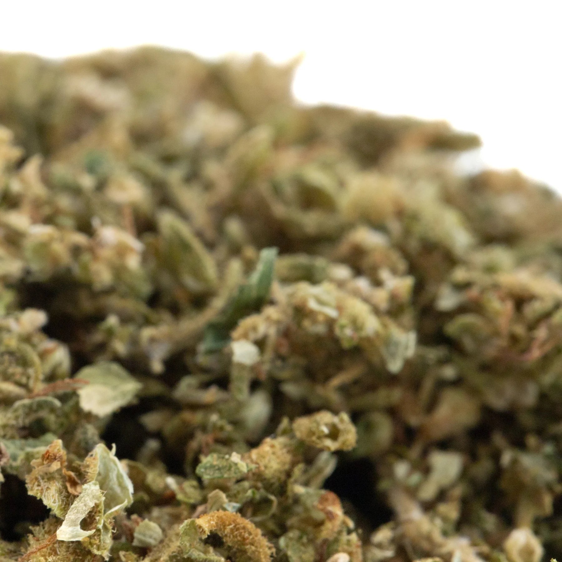 A dense green and brown pre-converted cbd cannabis bud with visible trichomes from tune cbd hemp flower trim