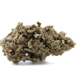 Dense textured turtle taffy thca flower wholesale hemp flower bud with green and brown hues covered in fine trichomes
