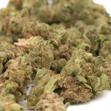 Pile of dried vanilla frosting hemp flower buds from dessert cannabis strain