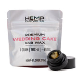 A silver pouch of hemp flower co wedding cake thca dab wax 1g with 98.55 percent thca and triangle kush details visible