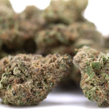 Green and brown zonkers thca greenhouse smalls cannabis buds with a frosty textured surface cookies n cream