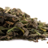 Dried green and brown sage leaves with a dusty texture from greenhouse zushi thca trim wholesale