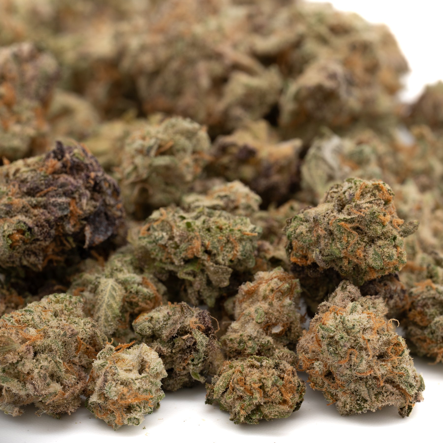 Dried Apricot CBD Hemp Flower Smalls with green, purple, and orange hues, CBD small buds