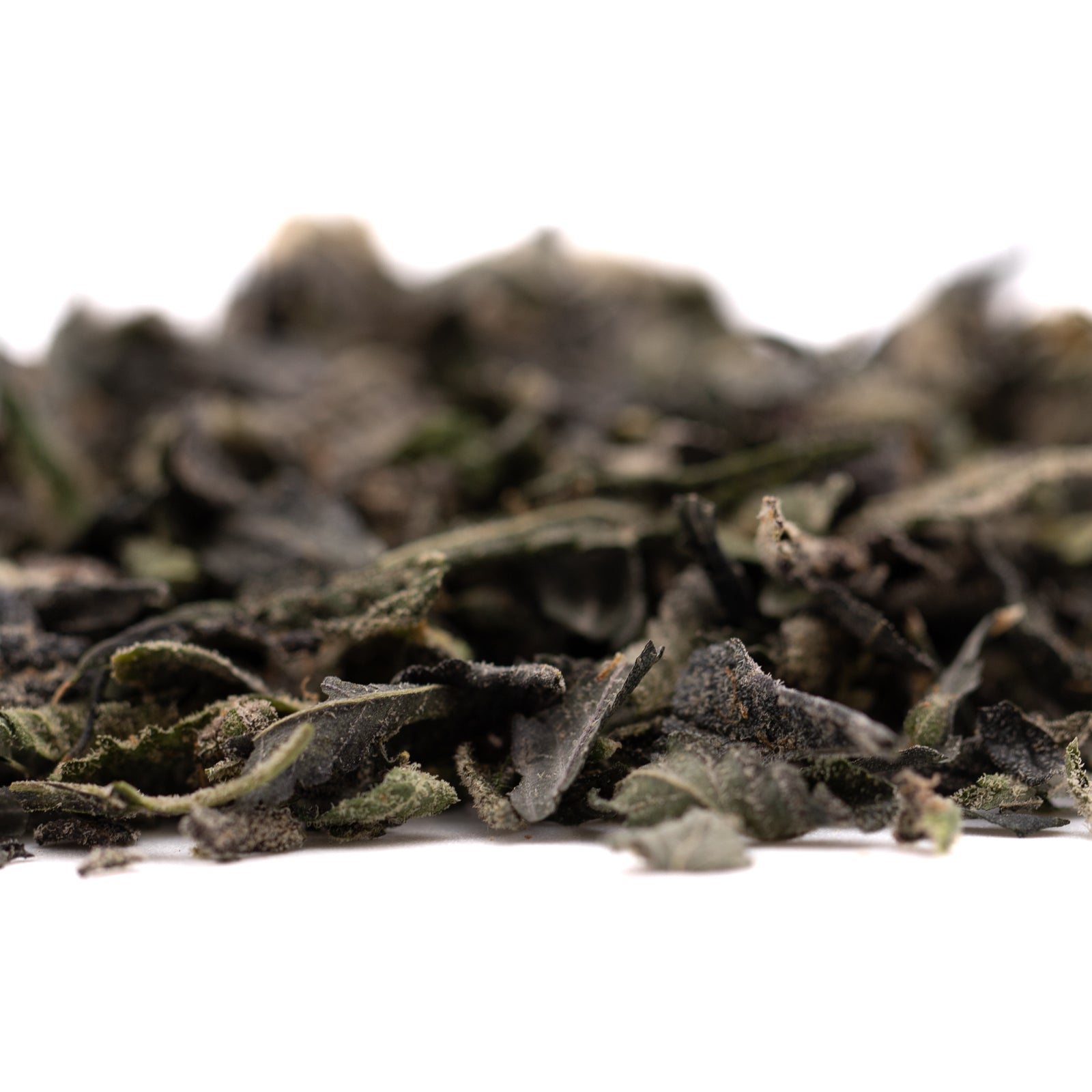 Dried dark green loose-leaf tea with Girl Scout Cookies, THCA trim, and hemp flower