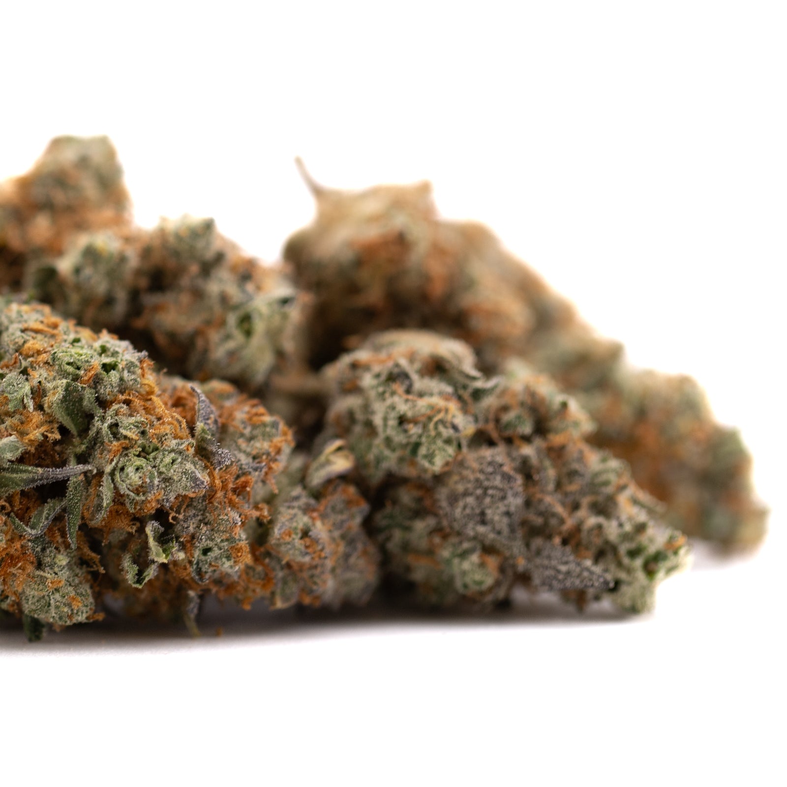 Close-up of Frosted Flakes Indoor THCa Flower showing vibrant green buds with orange hairs and frosty trichomes