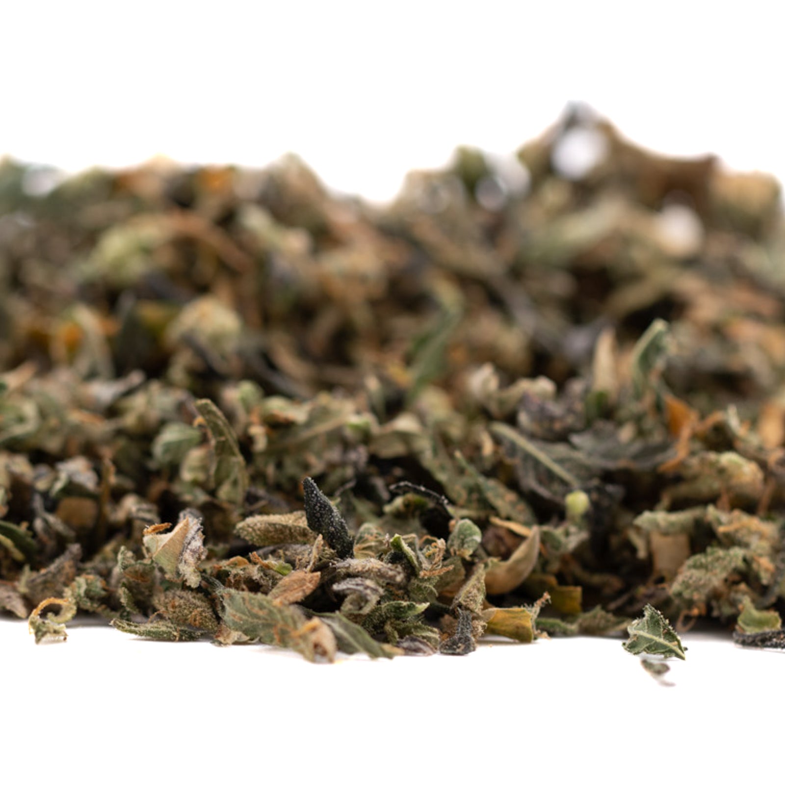 Pile of dried herbs with green crack and sour apple notes for Granny Crack Indoor THCa Trim Wholesale