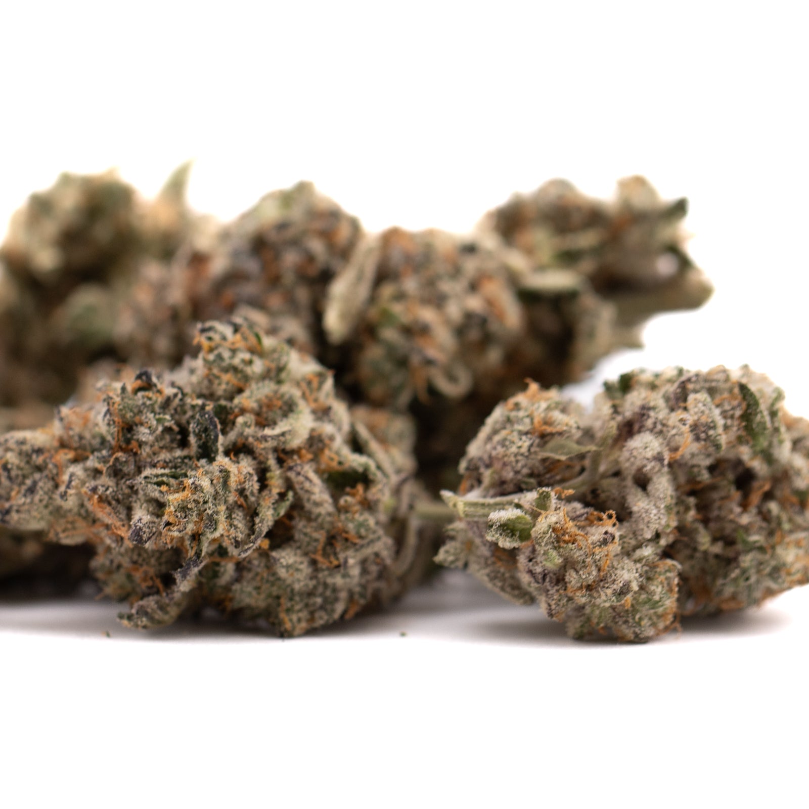 Hooch Indoor THCa Flower with purple coloration and trichome-rich fluffy cannabis buds