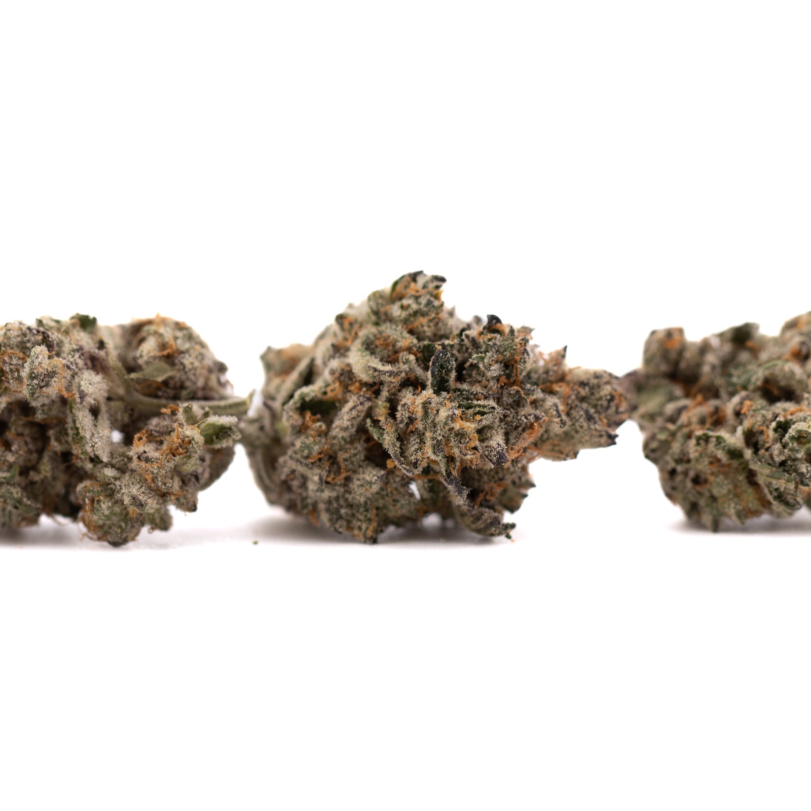 Premium indoor THCA flower with dense trichomes and orange pistils at Hooch Indoor THCA Flower