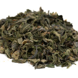 Pile of dried green herbs for Lemon Cherry Gelato THCa Indoor Trim Wholesale 1LB