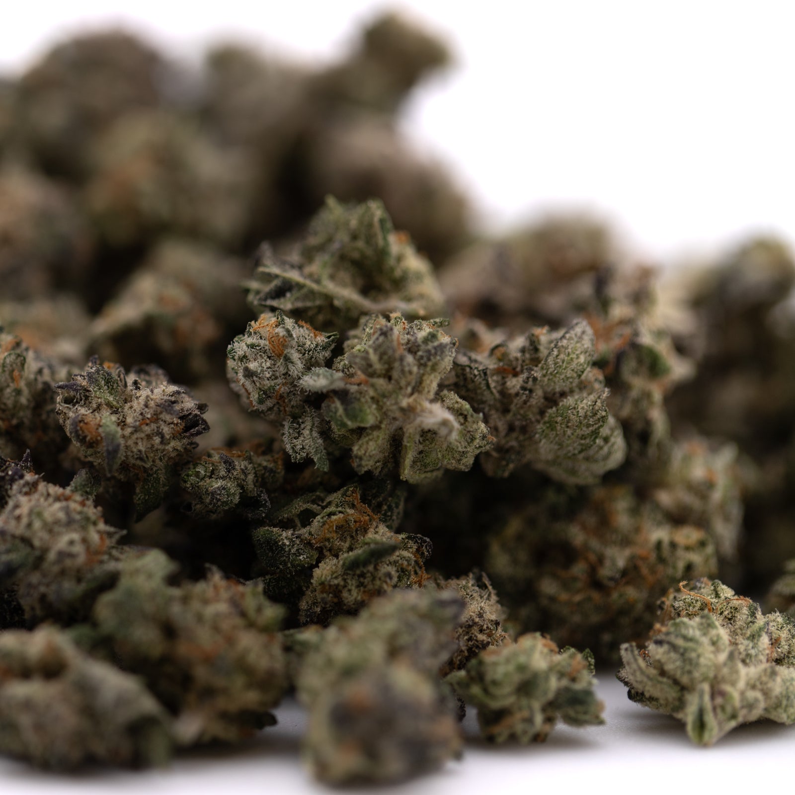 Peach Pie Indoor THCa Hemp Flower Smalls with green buds, orange hairs, and white trichomes