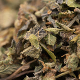 Pile of dried herbs from Pressure THCa Indoor Trim Wholesale 1LB product