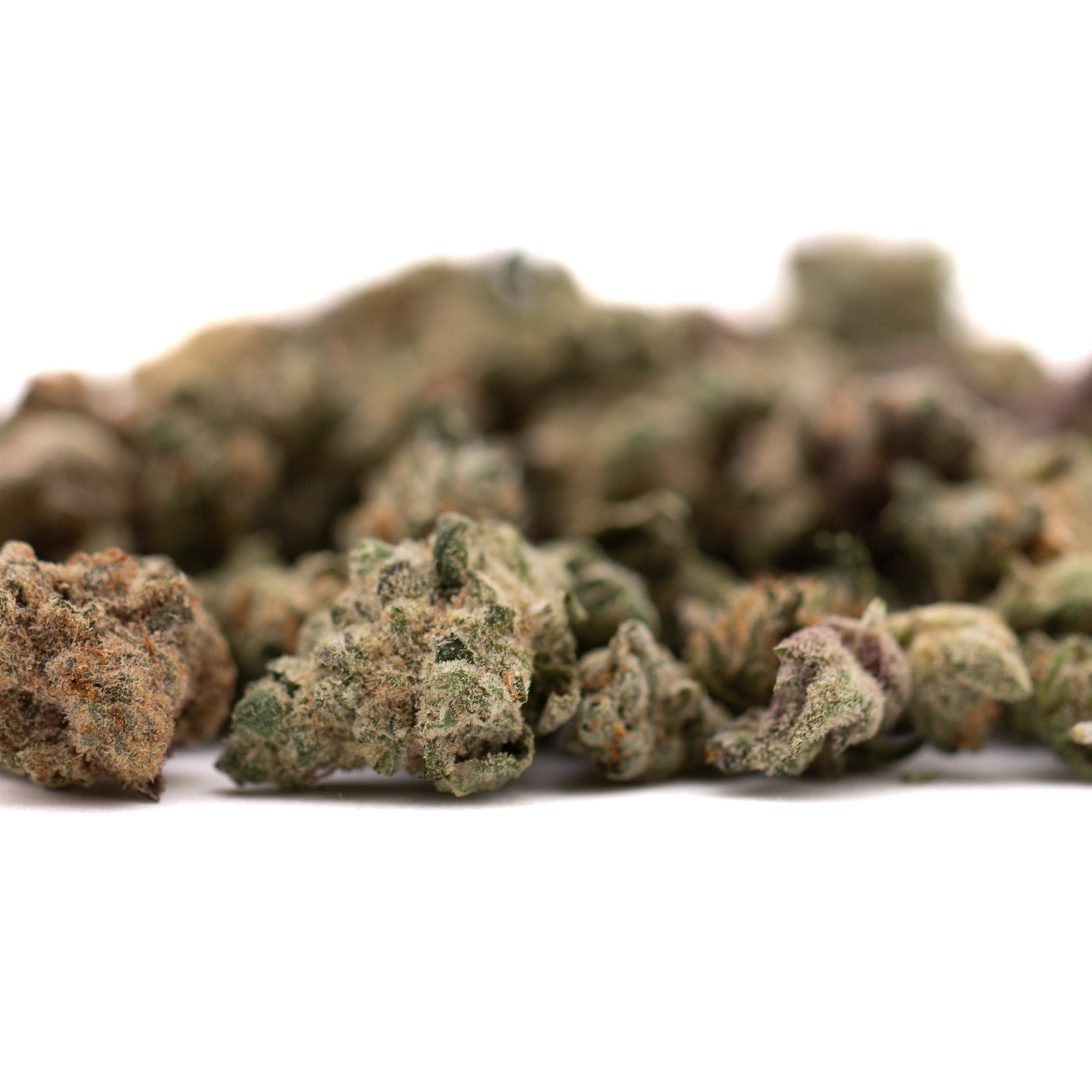 Pile of dried Sour Candy Indoor THCa Flower Smalls for premium indoor THCa flower products