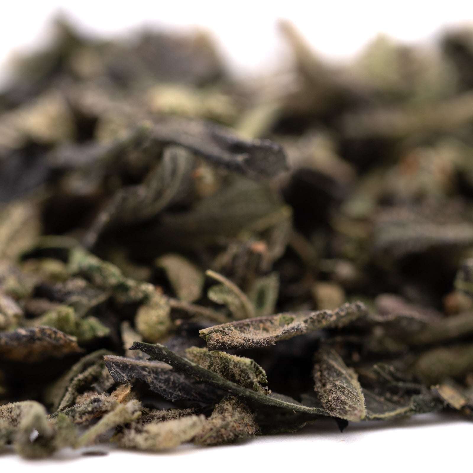Loose leaf green tea with fuzzy dried leaves for Sour Candy Indoor Thca Trim terpene profile
