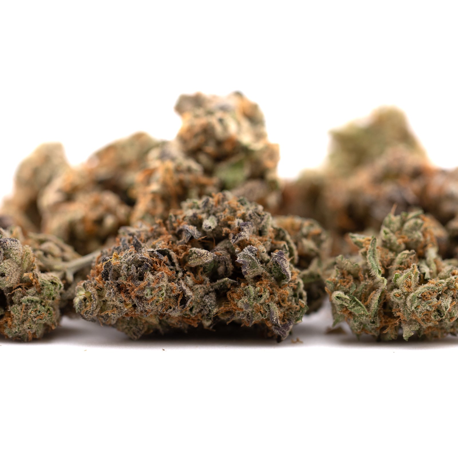 Dried Southern Peaches THCA Flower with green, orange, purple hues and mushy texture