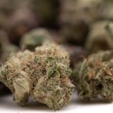 Dried Super Runtz Indoor THCa Flower Smalls with rich trichomes and orange pistils