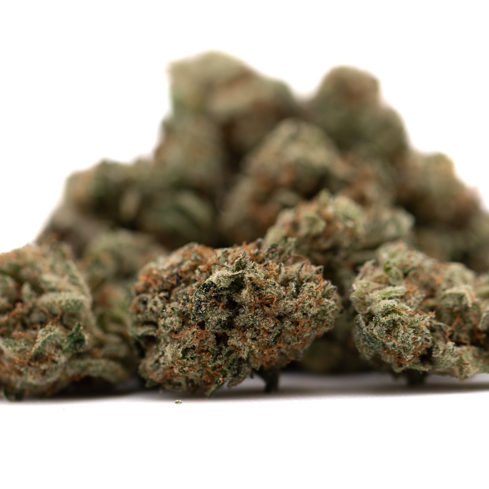 Dried Tropical Punch THCa Flower Smalls with green and orange hues from indoor cultivation